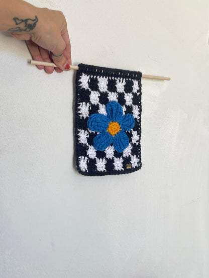 Flower with checkered crochet wall hanger